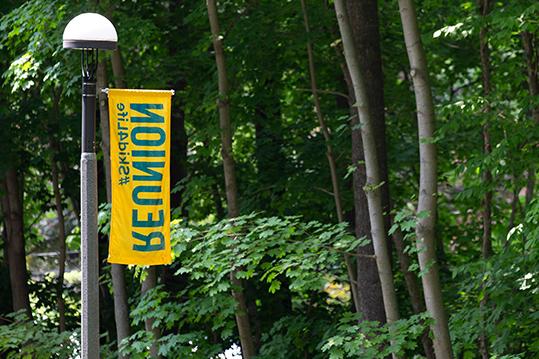 Reunion Banner in front of trees